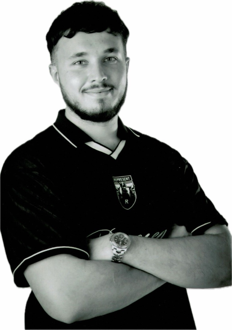 Glenn Wood, arms folded, smiling